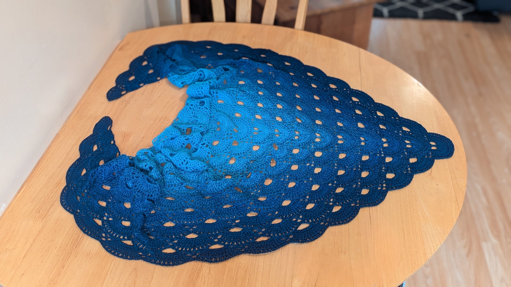 Blue lace doily on a wooden table