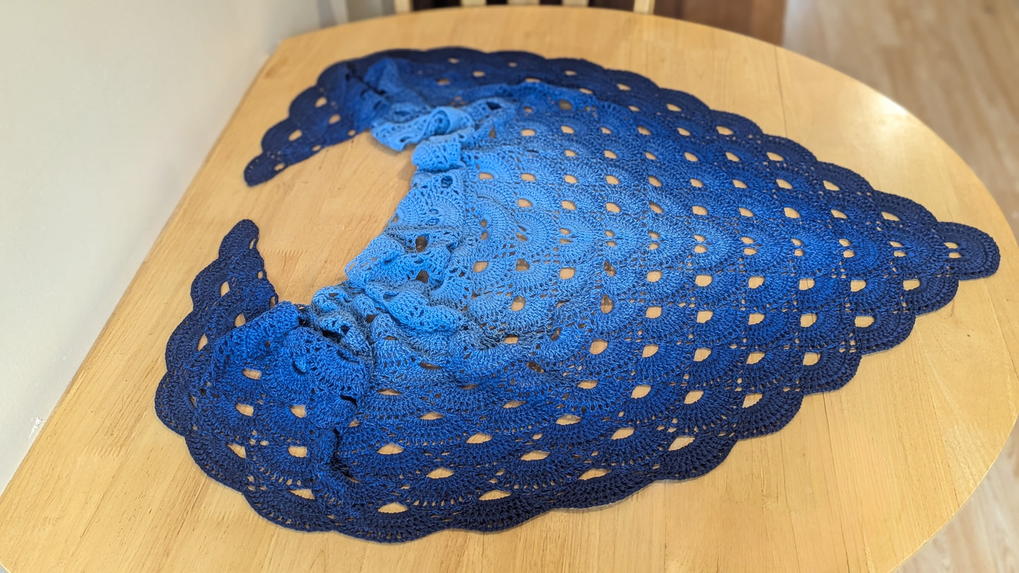 Blue shawl on a wooden surface