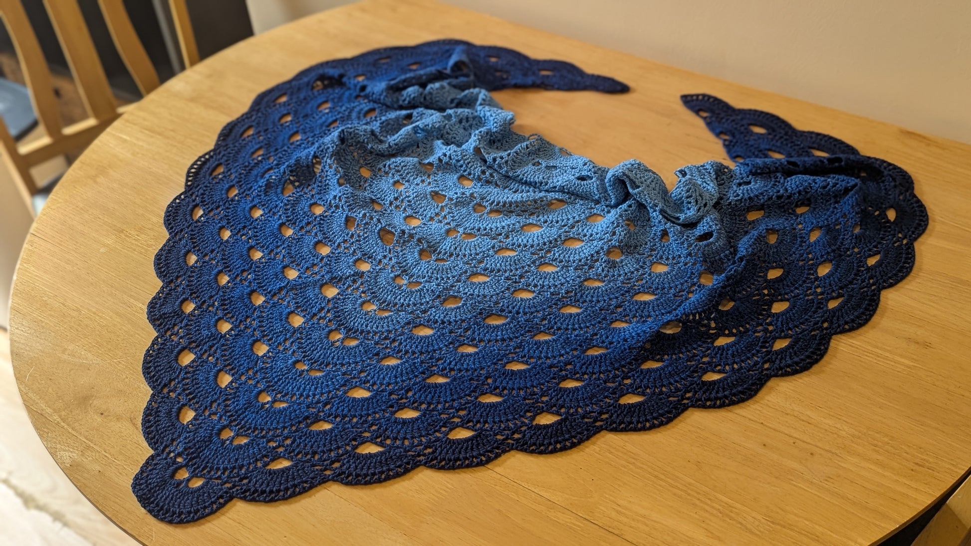 Blue lace shawl on a wooden table